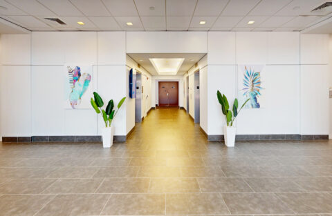 Modern office lobby with contemporary furnishings at 900 Broken Sound Parkway in Boca Raton