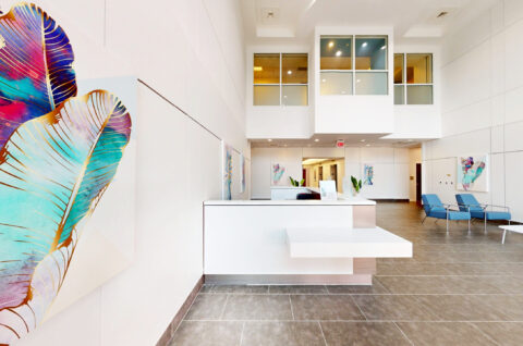 Modern office lobby with contemporary furnishings at 900 Broken Sound Parkway in Boca Raton